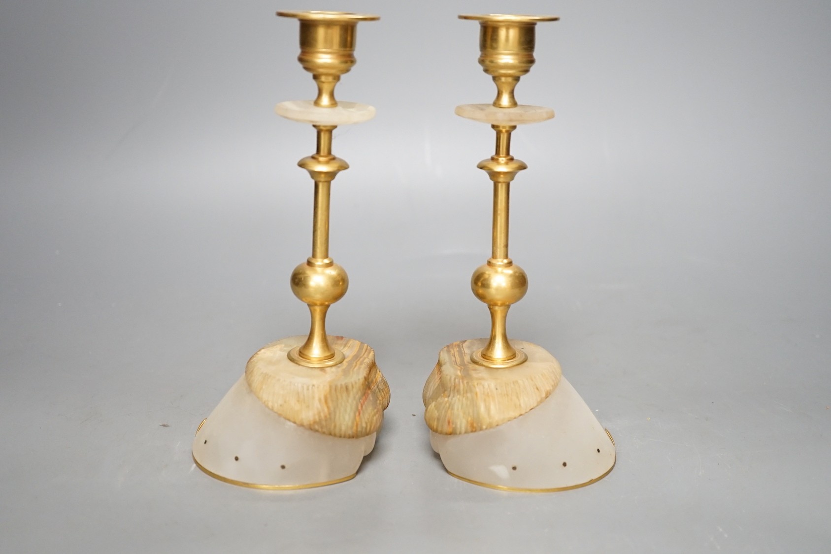 A pair of gilt metal and hardstone 'hoof' candlesticks, 19cm